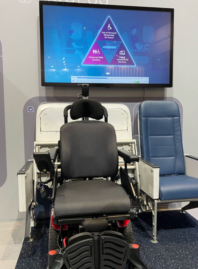 Air4All as showcased on Airbus' stand at AIX 2025. A wheelchair slots into a space created by two retractable economy class aircraft seat bottoms.